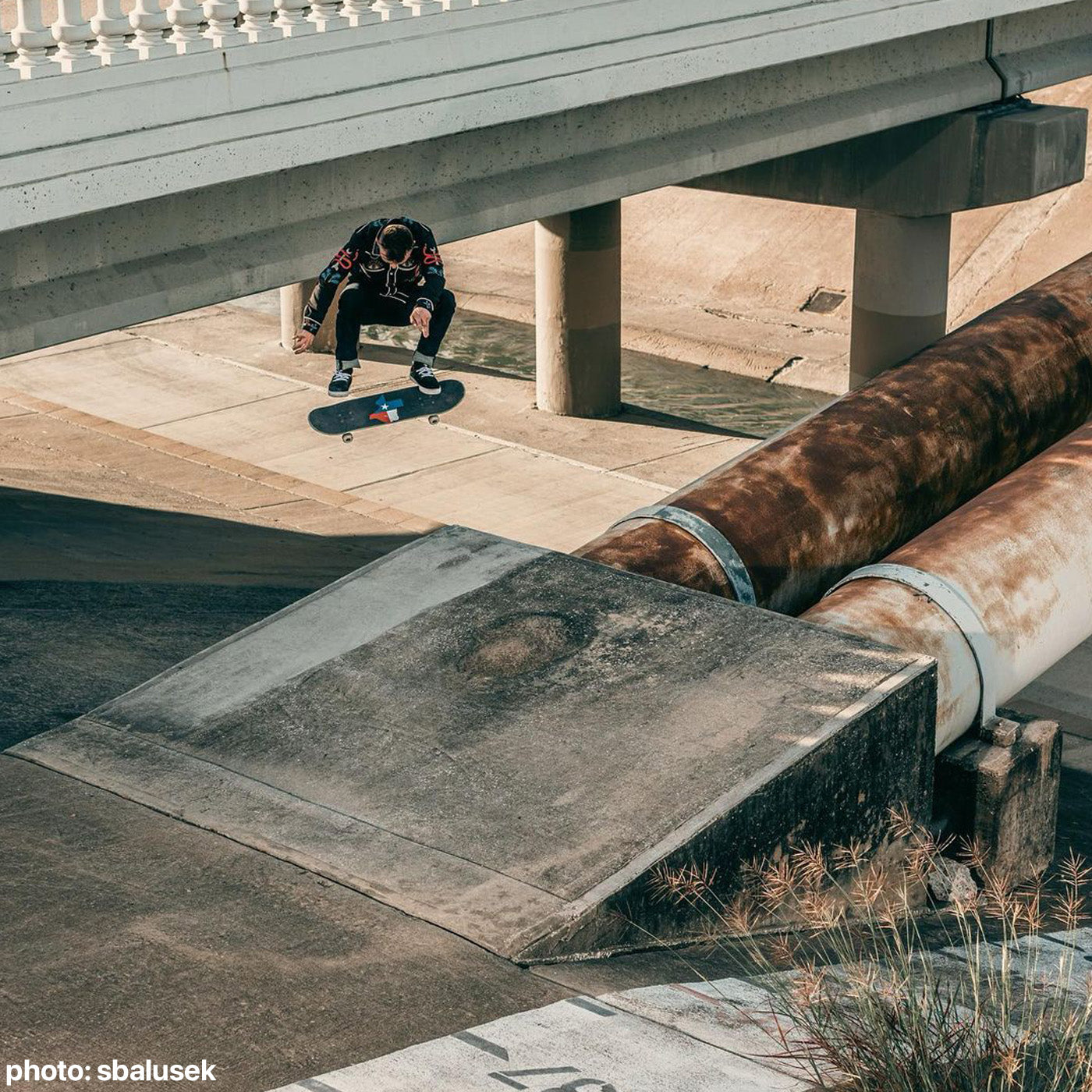 Cody McEntire doing a nollie backside flip with Cloud 9 Texas Griptape.