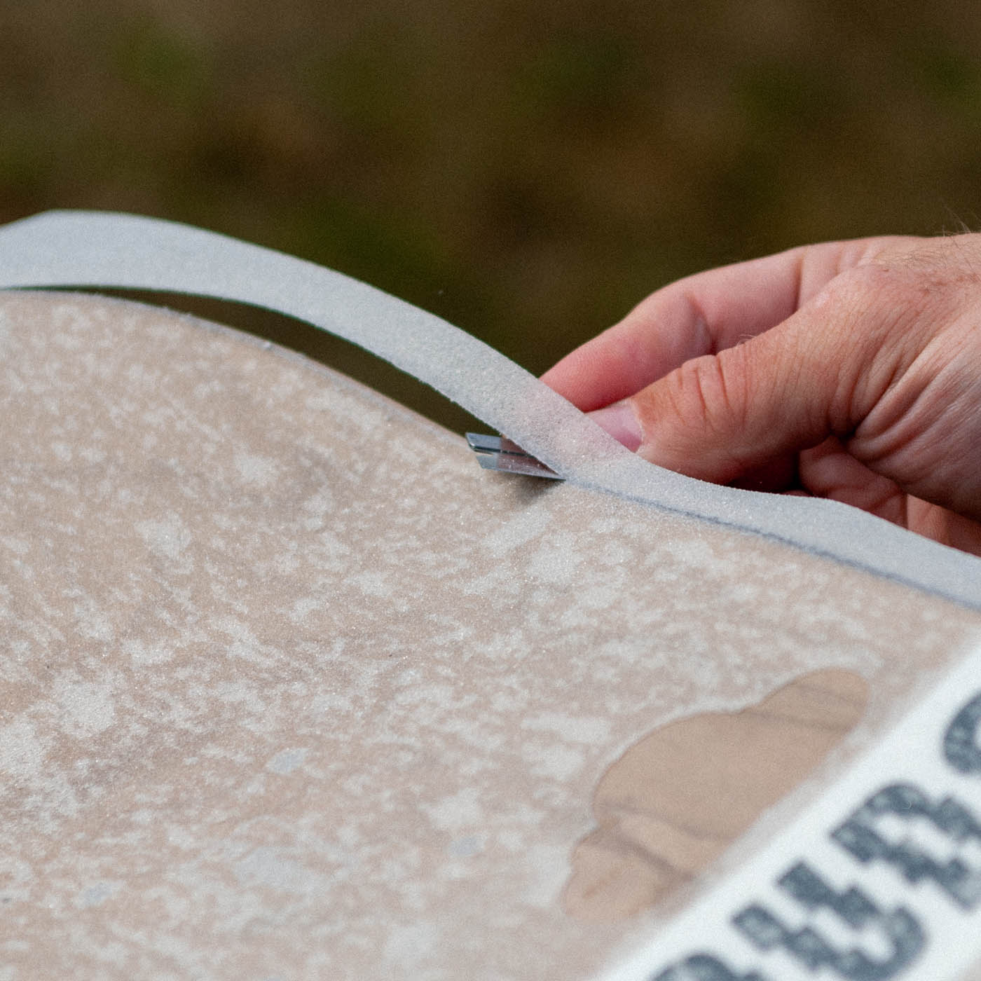 Cut your grip tape with a razorblade or a retractable blade knife.