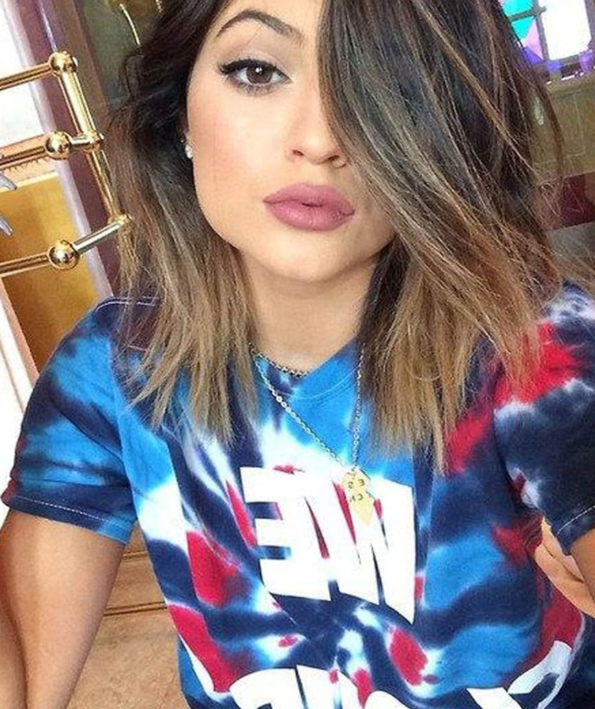 Kylie Jenner wearing the We Cloud 9 Grippy Tie Dye T-shirt.